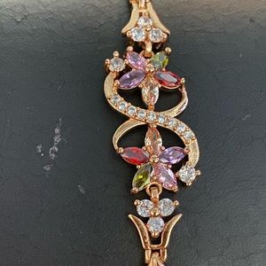 Gold tone with multicolored Christals